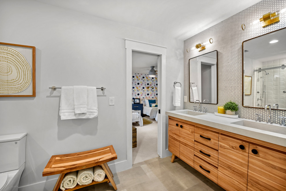Bathroom - mid-sized 1960s kids' white tile ceramic tile, gray floor and double-sink bathroom idea in Jacksonville with flat-panel cabinets, medium tone wood cabinets, an integrated sink, concrete countertops, gray countertops and a freestanding vanity