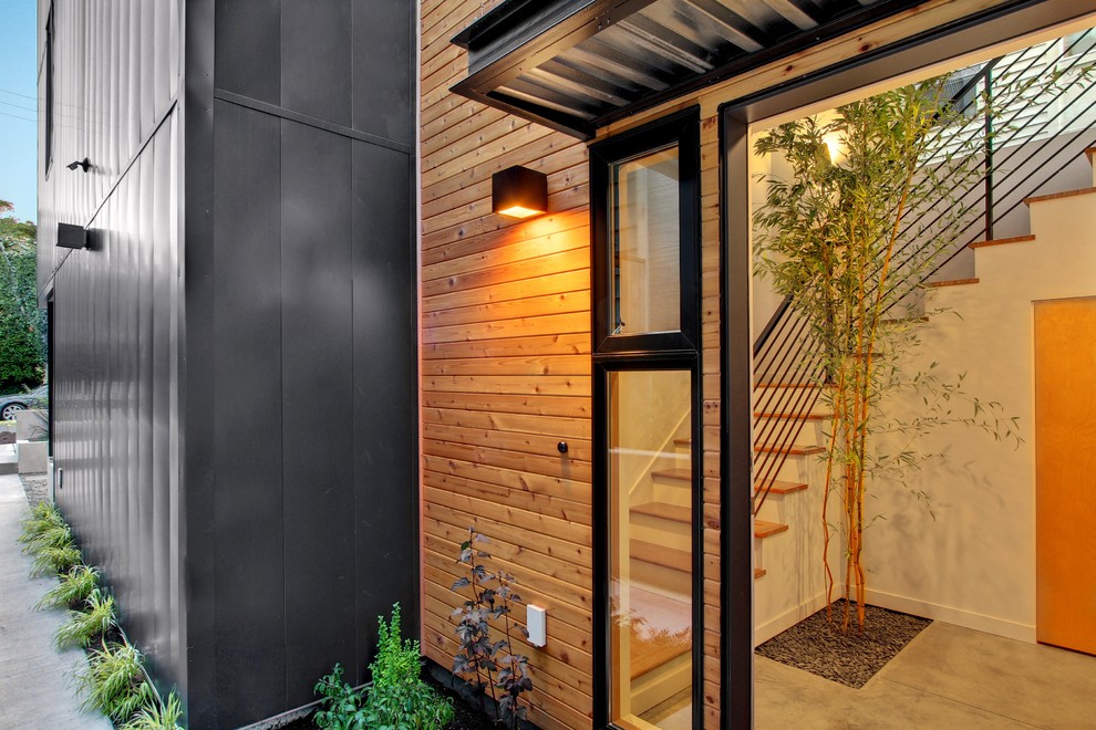 Inspiration for a contemporary entryway in Seattle with concrete floors.