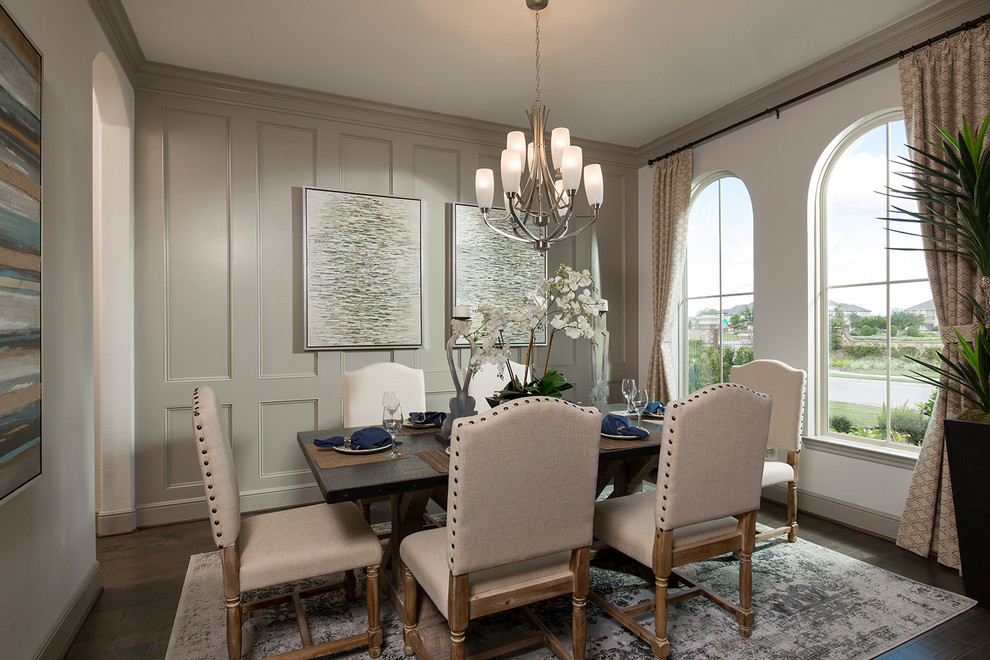 Traditional separate dining room in Houston with beige walls, dark hardwood floors and no fireplace.