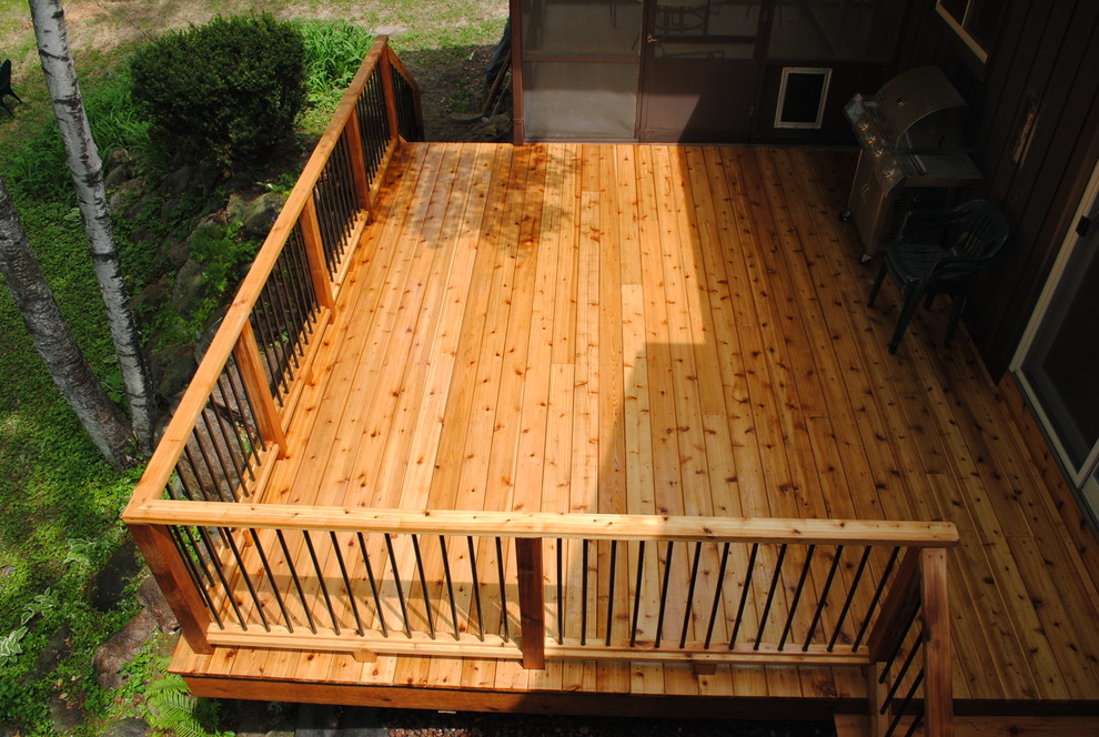 Deck - mid-sized craftsman side yard deck idea with a roof extension