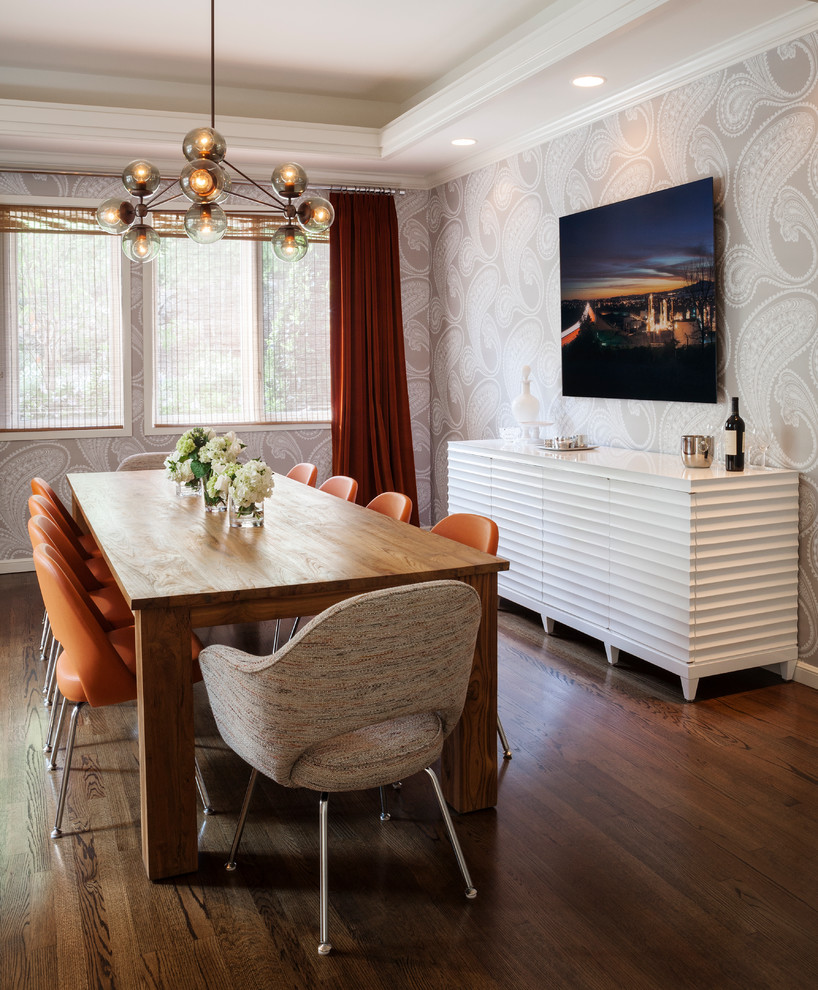 Inspiration for a large modern medium tone wood floor enclosed dining room remodel in San Diego with gray walls