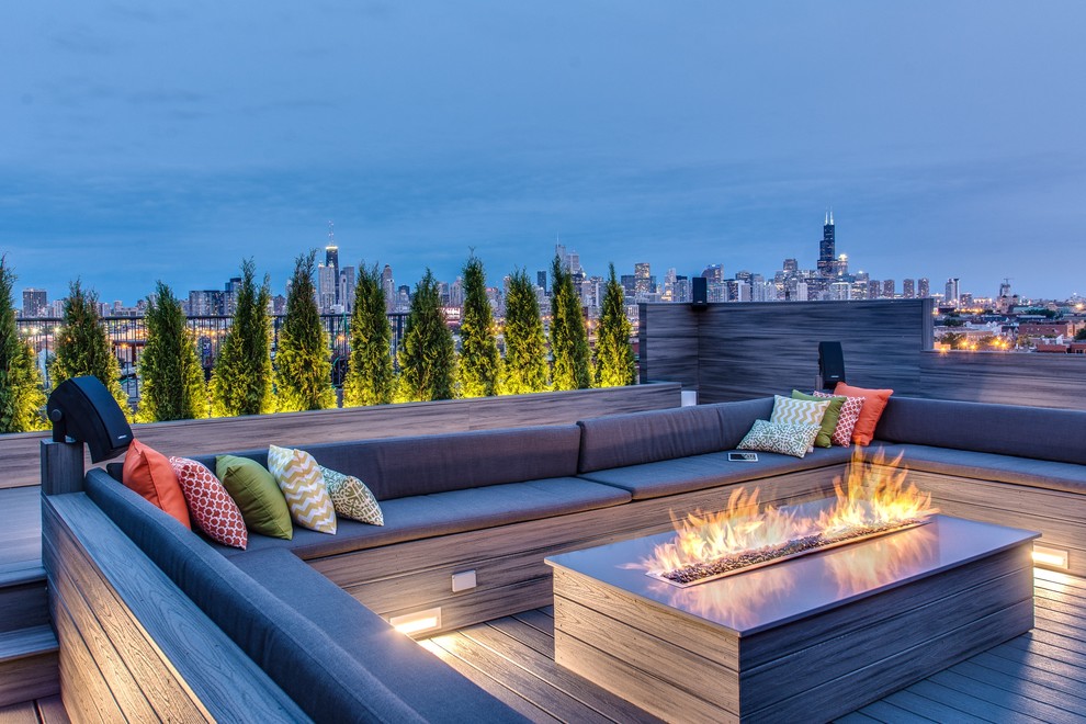 Design ideas for an expansive modern rooftop deck in Chicago with a fire feature and no cover.