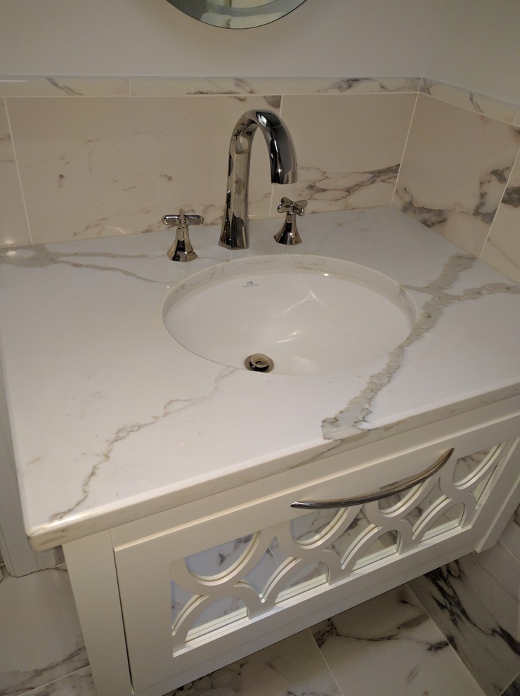 Inspiration for a mid-sized transitional master gray tile marble floor alcove bathtub remodel in DC Metro with furniture-like cabinets, white cabinets, a wall-mount toilet, gray walls, an undermount sink and marble countertops