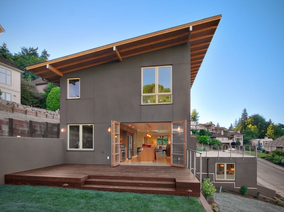 Design ideas for a contemporary three-storey exterior in Seattle with a shed roof.