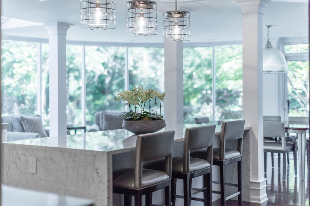 Eat-in kitchen - large transitional galley dark wood floor eat-in kitchen idea in Philadelphia with an undermount sink, recessed-panel cabinets, white cabinets, white backsplash, an island, quartzite countertops, ceramic backsplash and paneled appliances