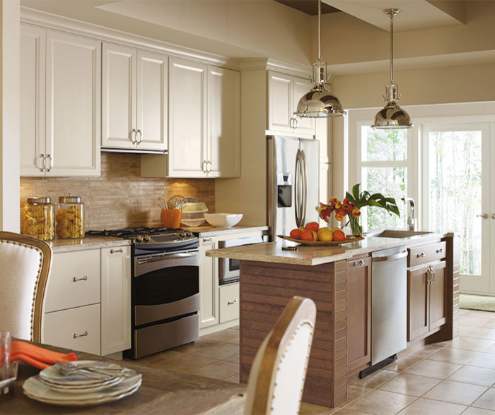 Eat-in kitchen - mid-sized transitional single-wall ceramic tile and white floor eat-in kitchen idea in Chicago with an undermount sink, recessed-panel cabinets, white cabinets, beige backsplash, stone tile backsplash, stainless steel appliances, an island and marble countertops