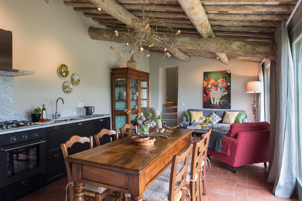 Inspiration for a large country open plan dining in Florence with white walls, terra-cotta floors and no fireplace.