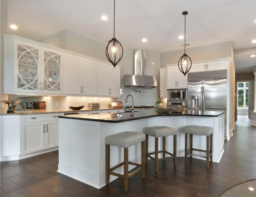 Inspiration for a transitional kitchen remodel with white cabinets and granite countertops