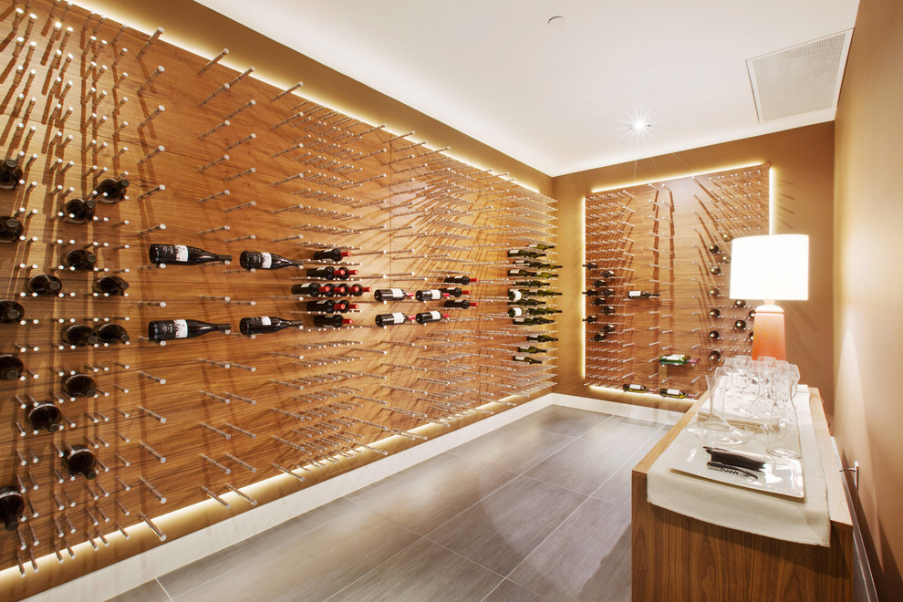 Design ideas for a large contemporary wine cellar in Los Angeles with porcelain floors and storage racks.