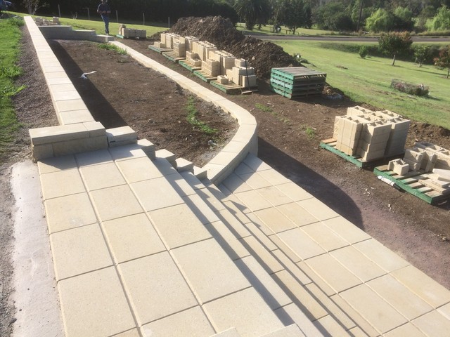 Modern stone retaining wall and large steps lantlig-traedgaard