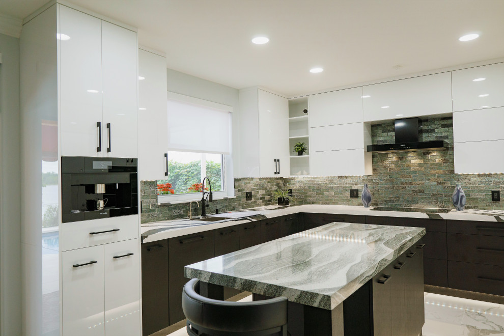 This is an example of a large contemporary u-shaped open plan kitchen in Miami with an undermount sink, flat-panel cabinets, white cabinets, quartz benchtops, metallic splashback, glass tile splashback, black appliances, porcelain floors, with island, multi-coloured floor and multi-coloured benchtop.