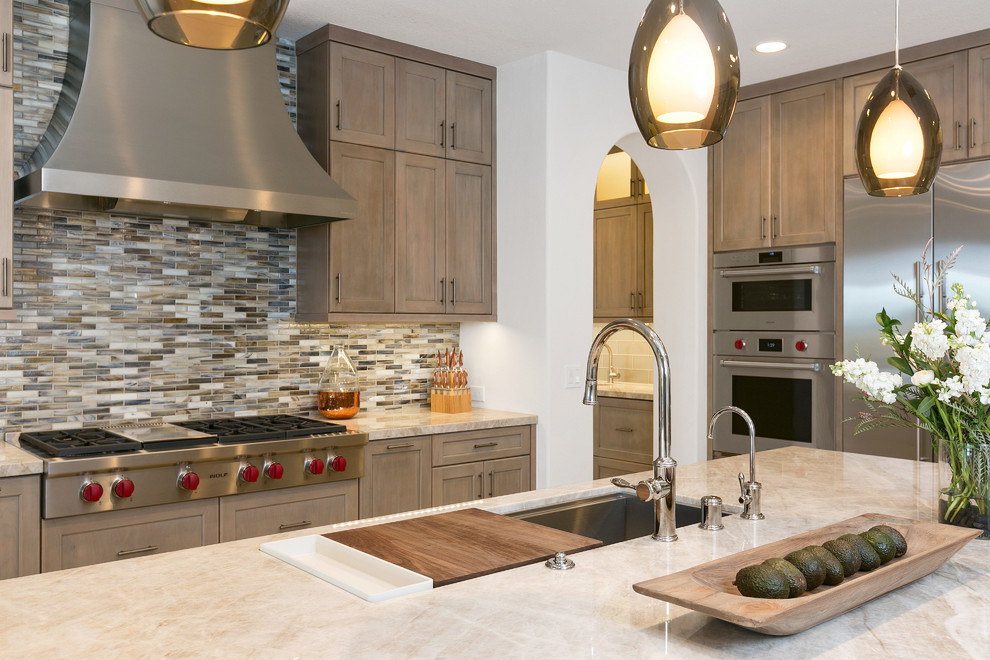 Inspiration for an expansive transitional l-shaped kitchen pantry in Tampa with an undermount sink, recessed-panel cabinets, grey cabinets, quartzite benchtops, multi-coloured splashback, glass tile splashback, stainless steel appliances, porcelain floors, with island, beige floor and grey benchtop.