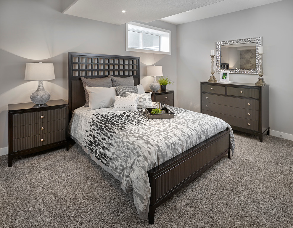 Inspiration for a large contemporary guest bedroom in Calgary with grey walls and carpet.