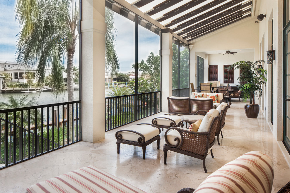 Photo of a tropical verandah in Miami with tile.