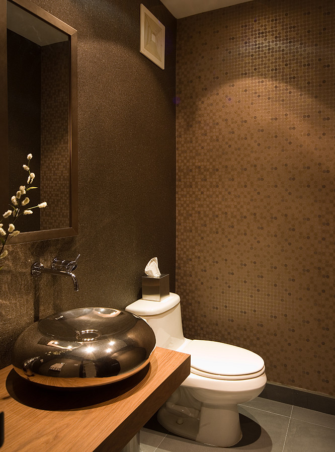 Small contemporary powder room in Other with light wood cabinets, wood benchtops, a one-piece toilet, a vessel sink, brown walls and ceramic floors.