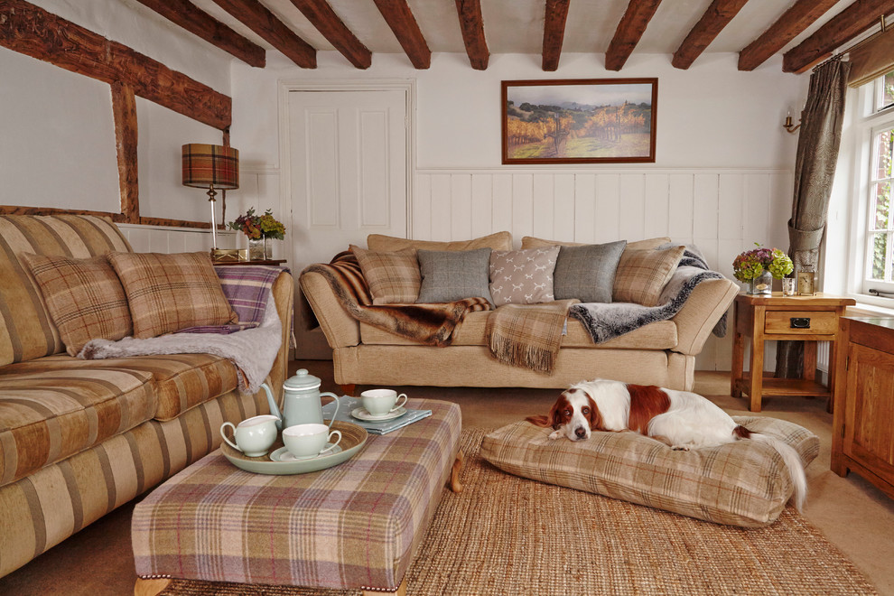 Inspiration for a country formal enclosed living room in Surrey with carpet and no fireplace.