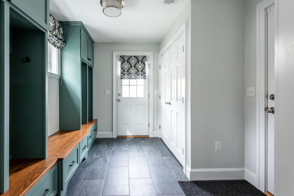 Mudroom - mid-sized transitional porcelain tile and gray floor mudroom idea in Boston with gray walls