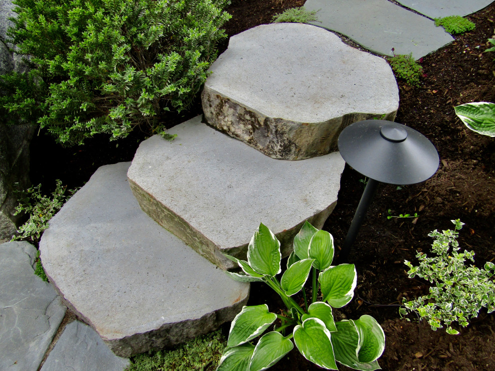 Inspiration for a beach style side yard shaded garden in Vancouver with a garden path and natural stone pavers.