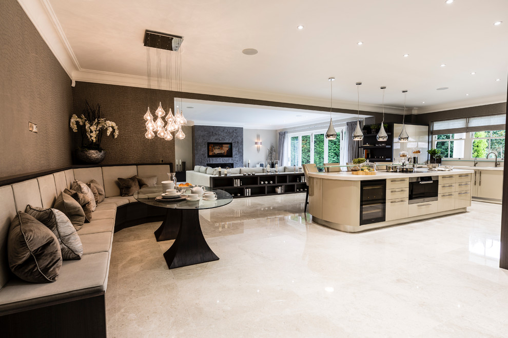 Design ideas for a contemporary open plan kitchen in Surrey with flat-panel cabinets, beige cabinets and with island.
