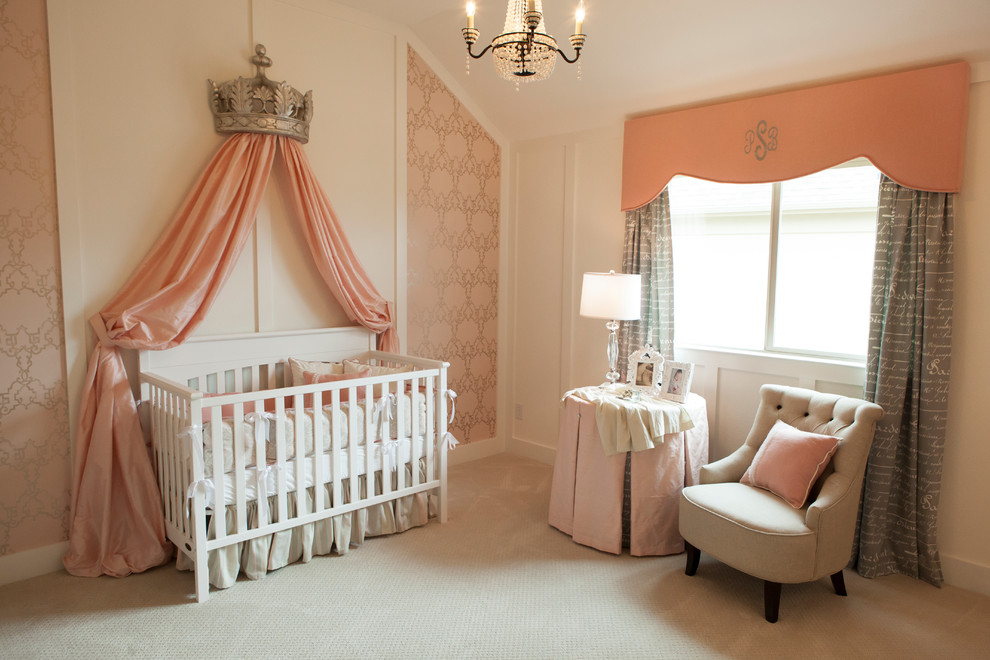 This is an example of a traditional nursery for girls in Dallas with pink walls, carpet and beige floor.