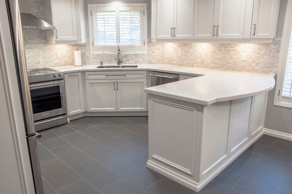 Example of a transitional kitchen design in Toronto