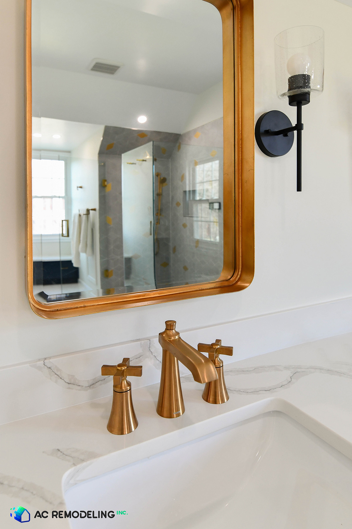 Antique gold mirror & 8" Widespread faucet in brushed gold.