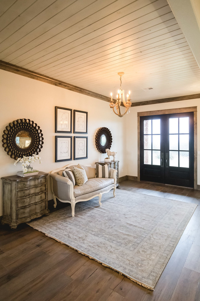 Country entryway in Oklahoma City with white walls, medium hardwood floors, a double front door and a dark wood front door.