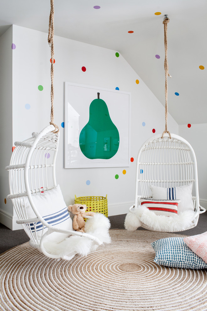 Inspiration for an expansive transitional gender-neutral kids' playroom for kids 4-10 years old in New York with multi-coloured walls and carpet.