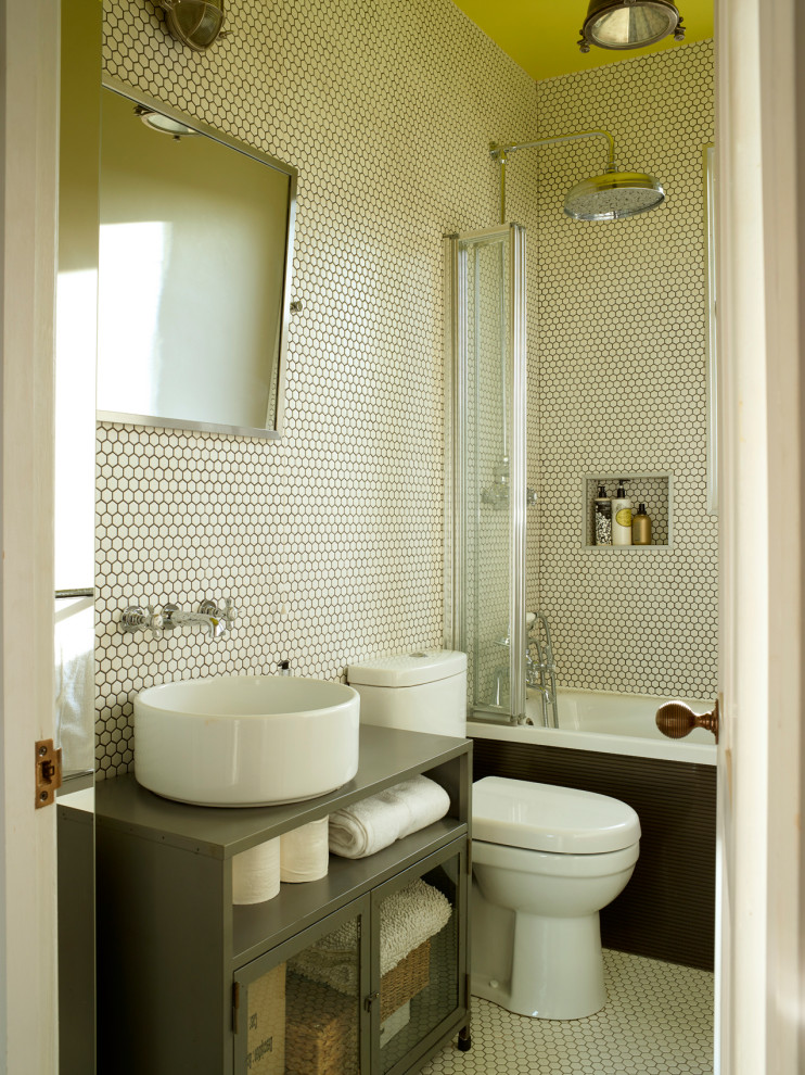 Inspiration for a transitional bathroom in London with glass-front cabinets, grey cabinets, an alcove tub, a shower/bathtub combo, white tile, mosaic tile, mosaic tile floors, a vessel sink, white floor, grey benchtops, a niche, a single vanity and a freestanding vanity.