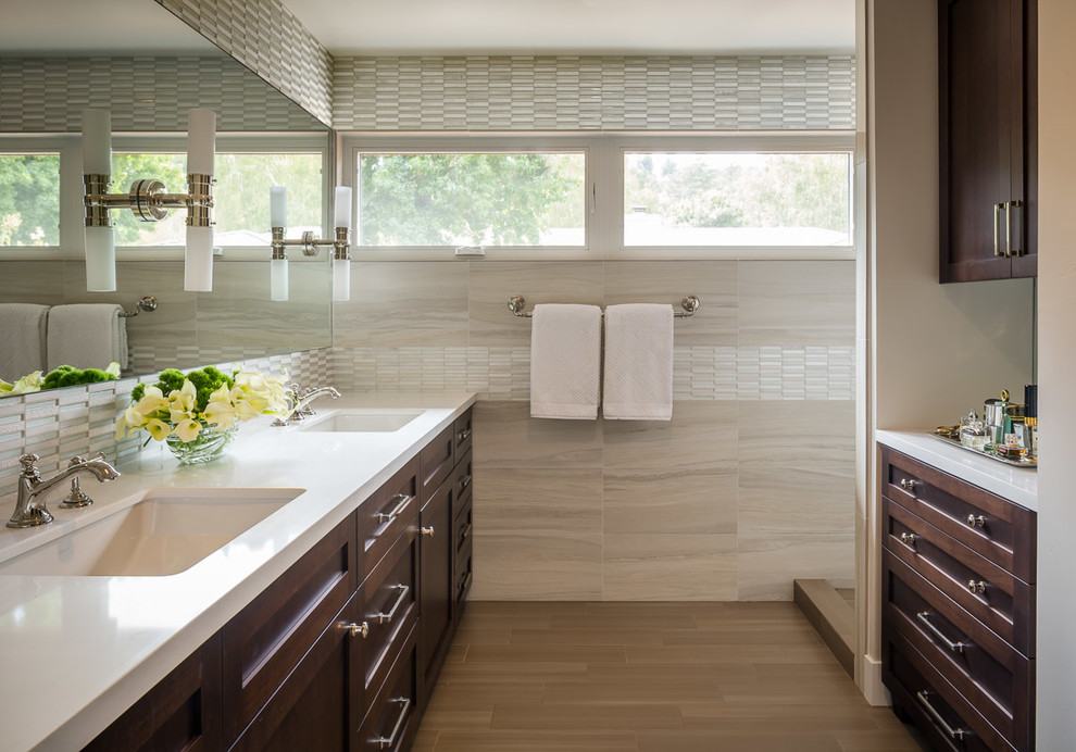 Photo of a transitional bathroom in San Francisco with an undermount sink, shaker cabinets and dark wood cabinets.