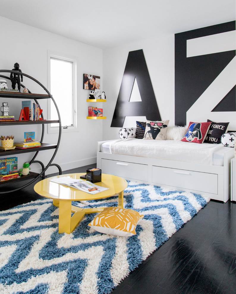 Photo of a contemporary kids' bedroom for kids 4-10 years old and boys in New York with white walls and black floor.