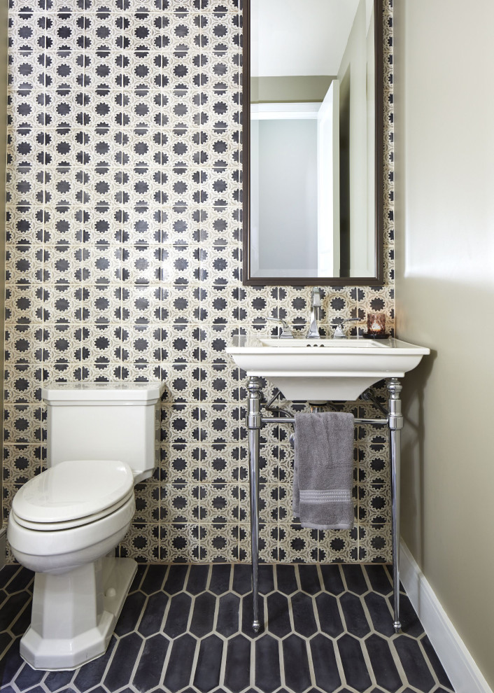 This is an example of a transitional powder room in Phoenix with black and white tile, grey walls, a console sink and black floor.