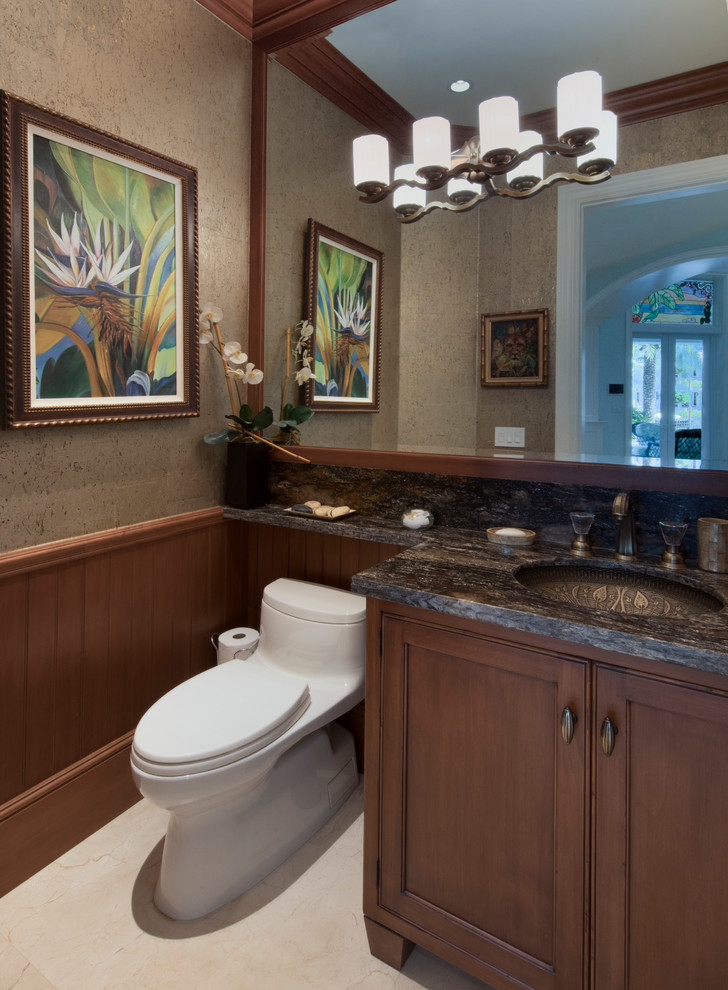 This is an example of an expansive tropical master bathroom in Miami with medium wood cabinets, blue walls and beige floor.
