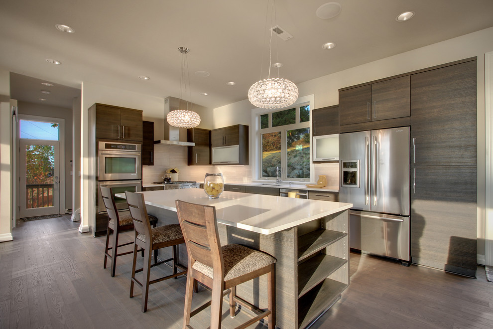 Contemporary kitchen in Seattle with stainless steel appliances and with island.