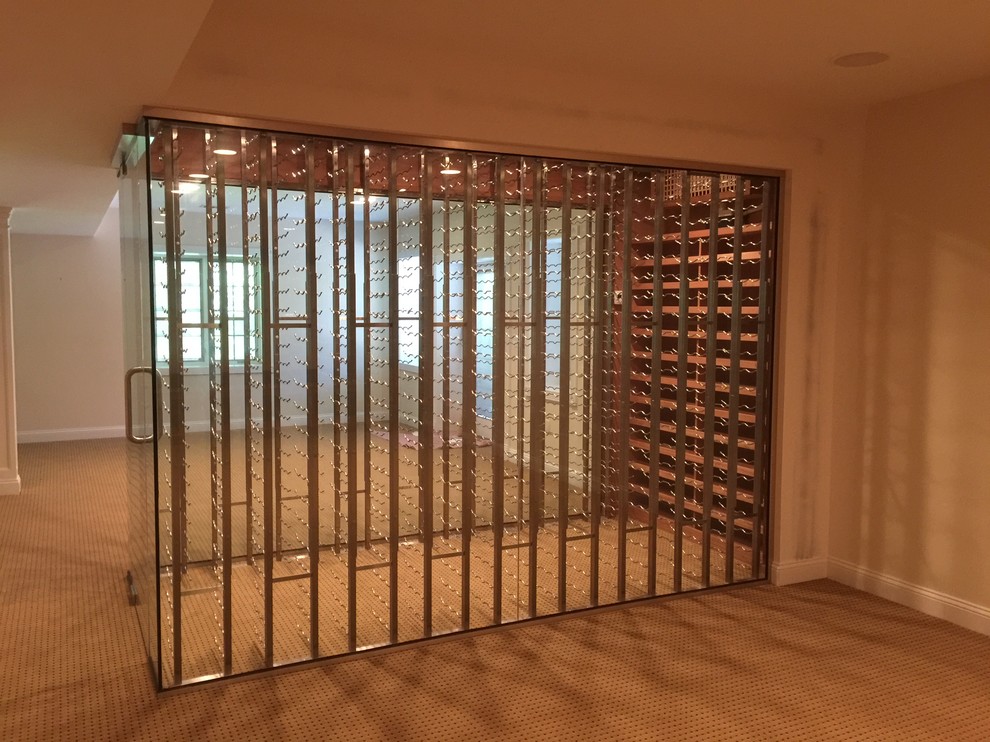 Inspiration for a small contemporary wine cellar in New York with carpet and display racks.