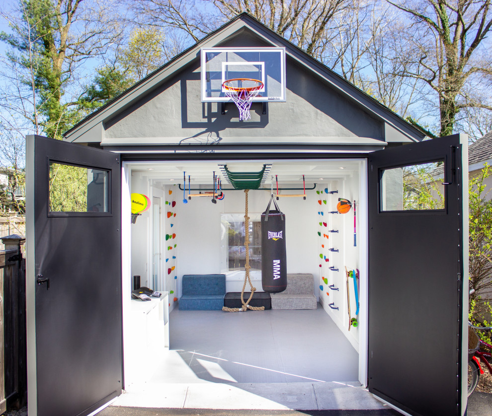 Small modern home climbing wall in New York with white walls and grey floor.