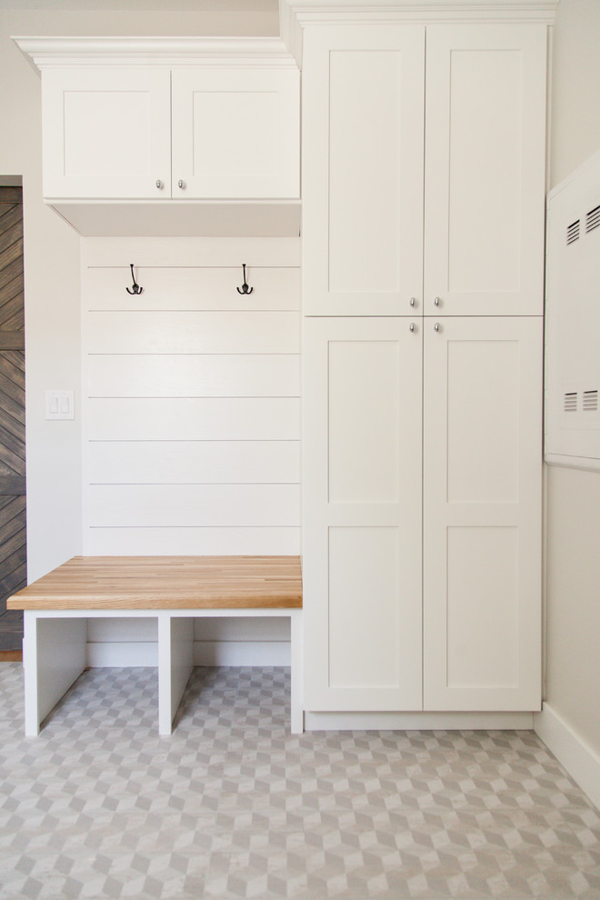 Inspiration for a small traditional entryway in Phoenix with grey walls and ceramic floors.