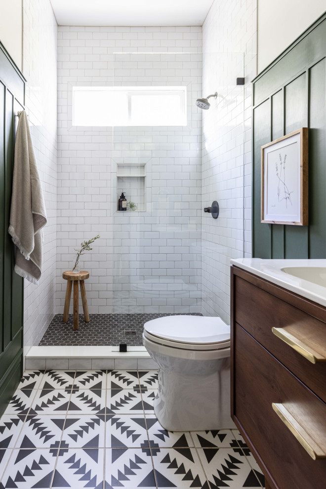 Inspiration for a small transitional 3/4 bathroom in Sacramento with dark wood cabinets, an open shower, a one-piece toilet, white tile, ceramic tile, green walls, cement tiles, an undermount sink, marble benchtops, multi-coloured floor, an open shower, white benchtops, a single vanity, a freestanding vanity and panelled walls.
