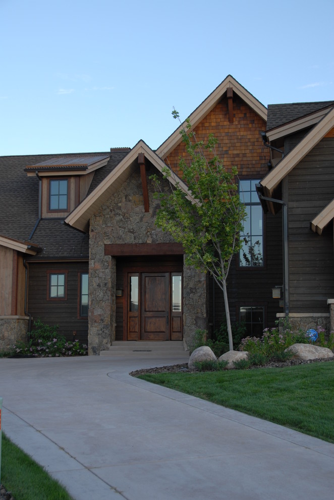 Inspiration for a mid-sized traditional three-storey green exterior in Denver with wood siding and a gable roof.