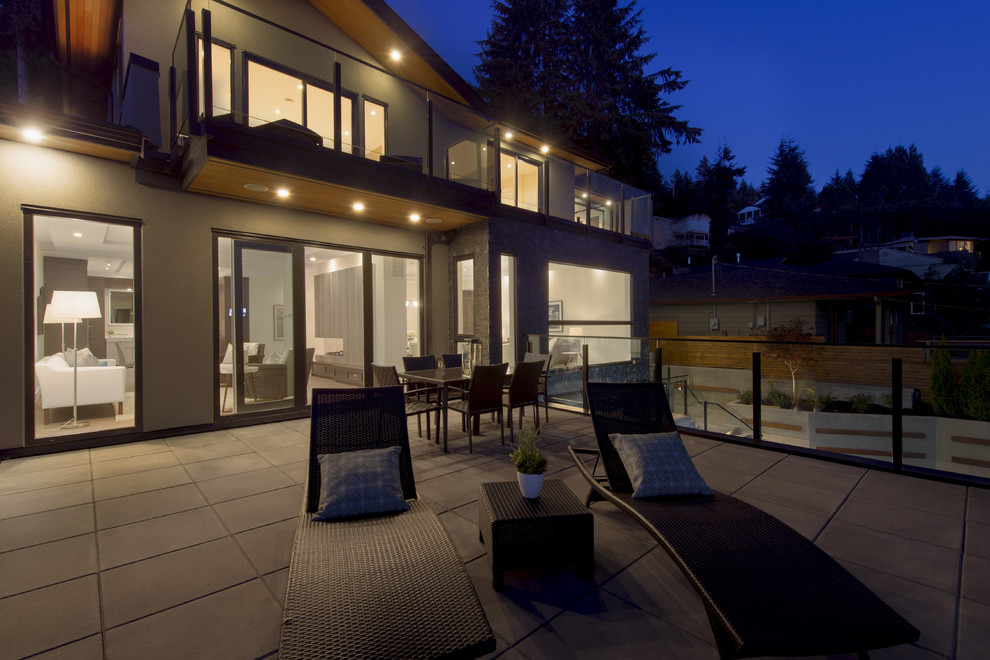 This is an example of a large modern rooftop deck in Vancouver with no cover.