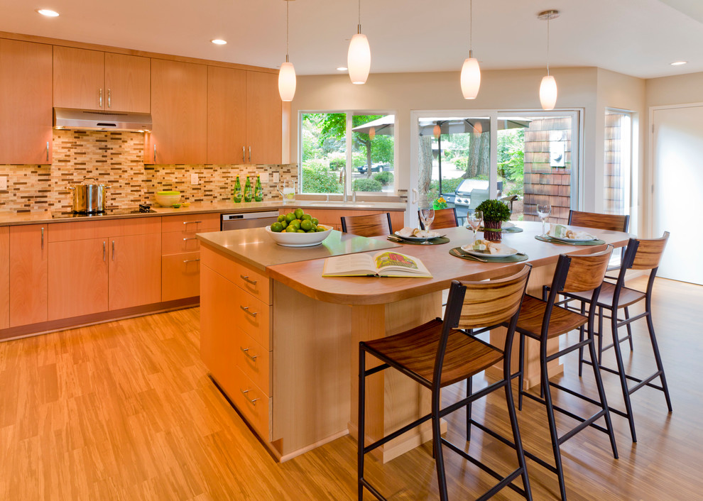 Photo of a contemporary kitchen in Portland with wood benchtops.