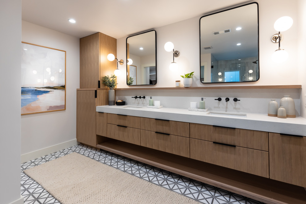 This is an example of a large modern ensuite bathroom in Dallas with flat-panel cabinets, light wood cabinets, an alcove shower, a two-piece toilet, white tiles, porcelain tiles, white walls, marble flooring, a submerged sink, engineered stone worktops, grey floors, a hinged door, white worktops, a shower bench, double sinks and a floating vanity unit.