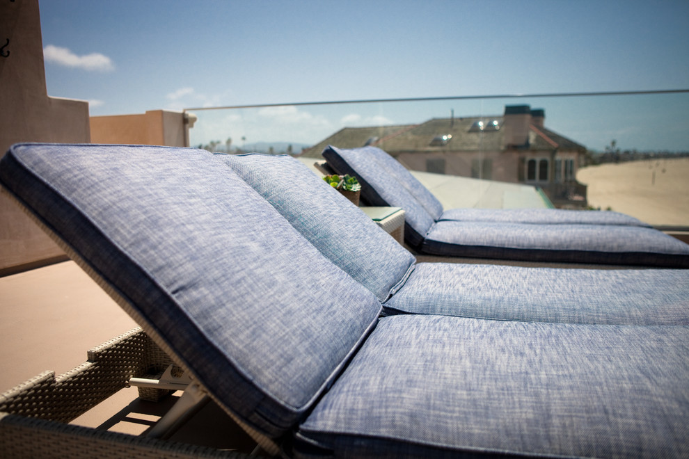 Huge transitional rooftop deck photo in Orange County with no cover