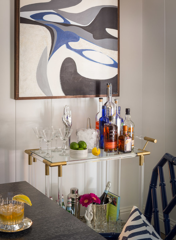 Small contemporary single-wall bar cart in San Francisco with no sink, glass benchtops, white splashback, light hardwood floors and brown floor.