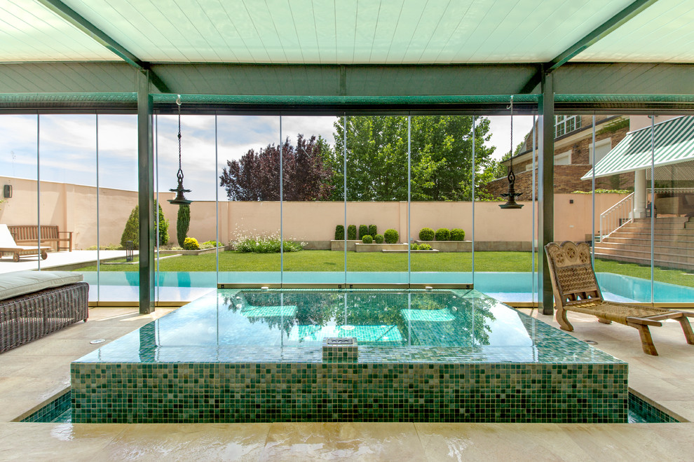 Inspiration for a small contemporary indoor rectangular aboveground pool in Other with a hot tub.