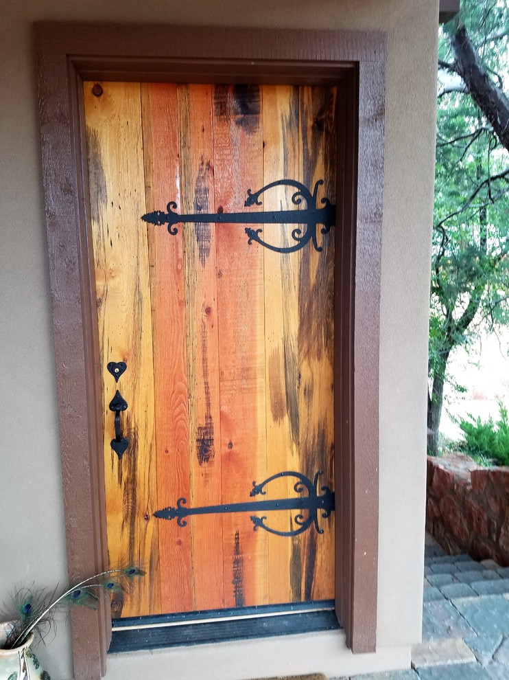 Mid-sized mountain style front door photo in Phoenix with a light wood front door