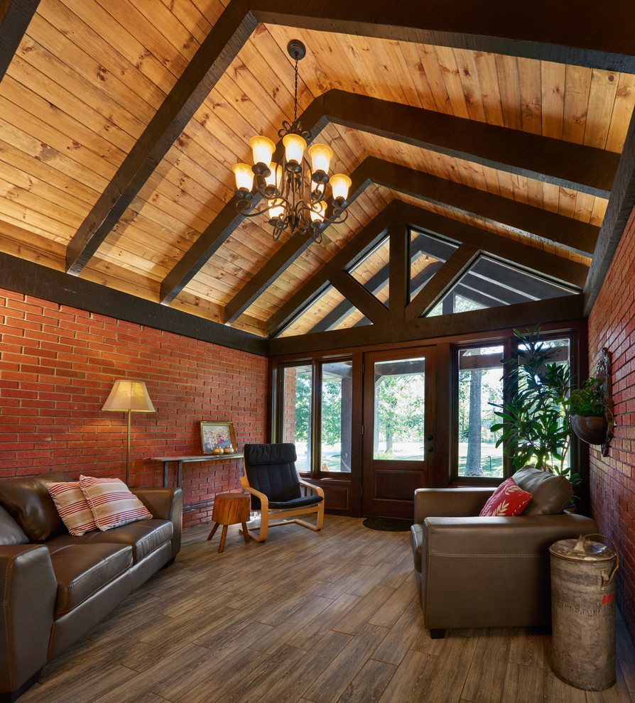 Inspiration for a rustic porcelain tile foyer remodel in Toronto with red walls and a dark wood front door
