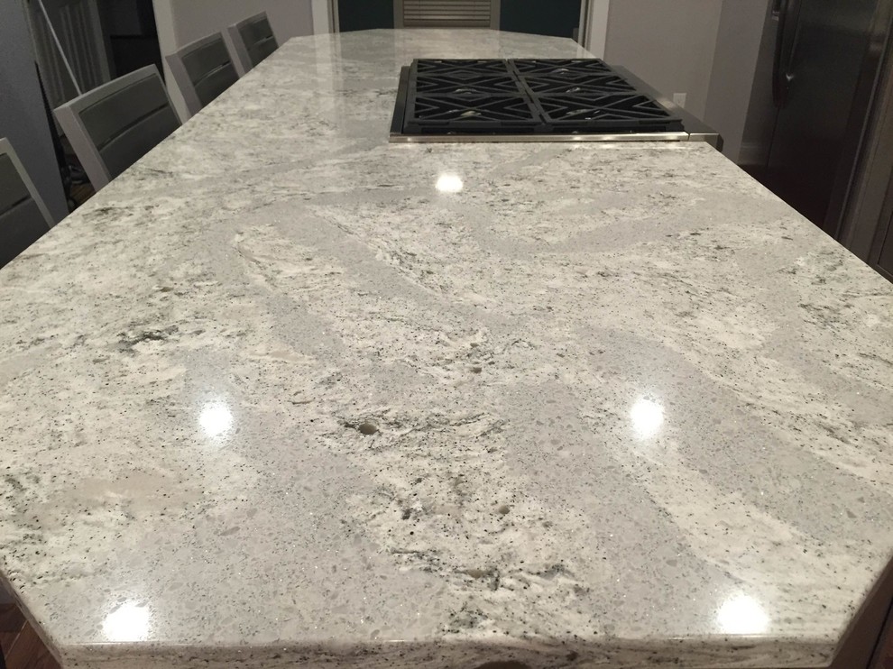 Large transitional l-shaped medium tone wood floor eat-in kitchen photo in Grand Rapids with a farmhouse sink, shaker cabinets, gray cabinets, quartz countertops, white backsplash, porcelain backsplash, stainless steel appliances and an island