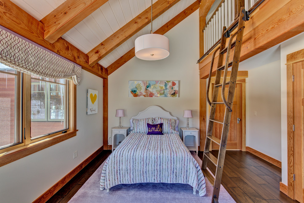 Large arts and crafts loft-style bedroom in Boston with dark hardwood floors and brown floor.