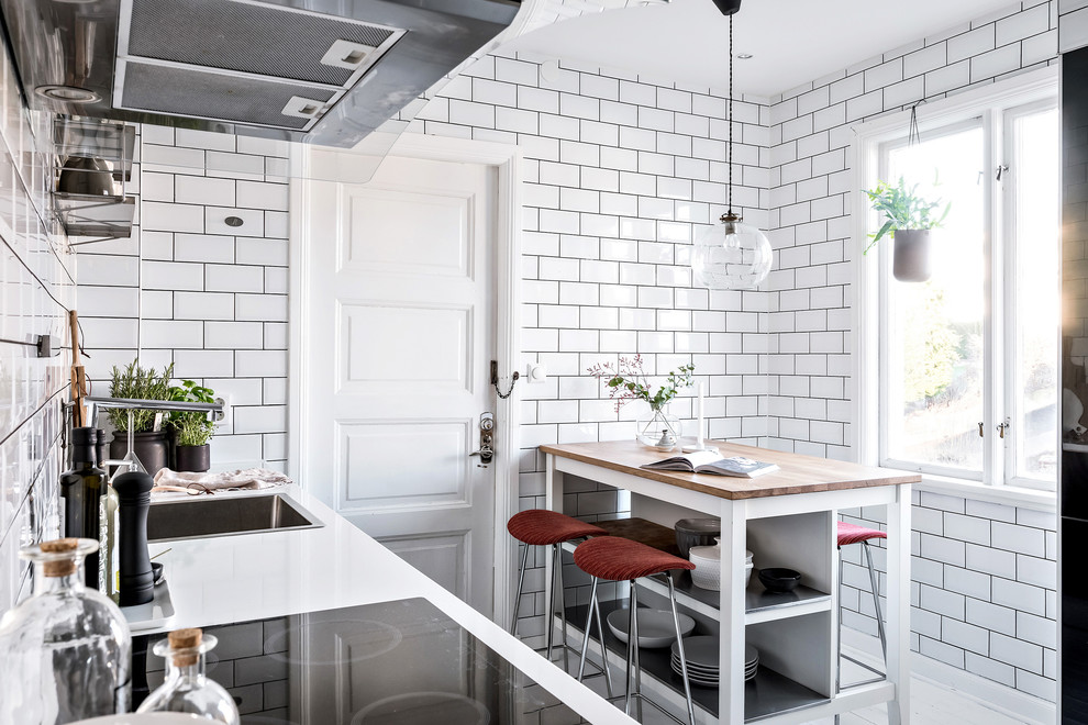 Photo of a small scandinavian kitchen in Gothenburg with with island.